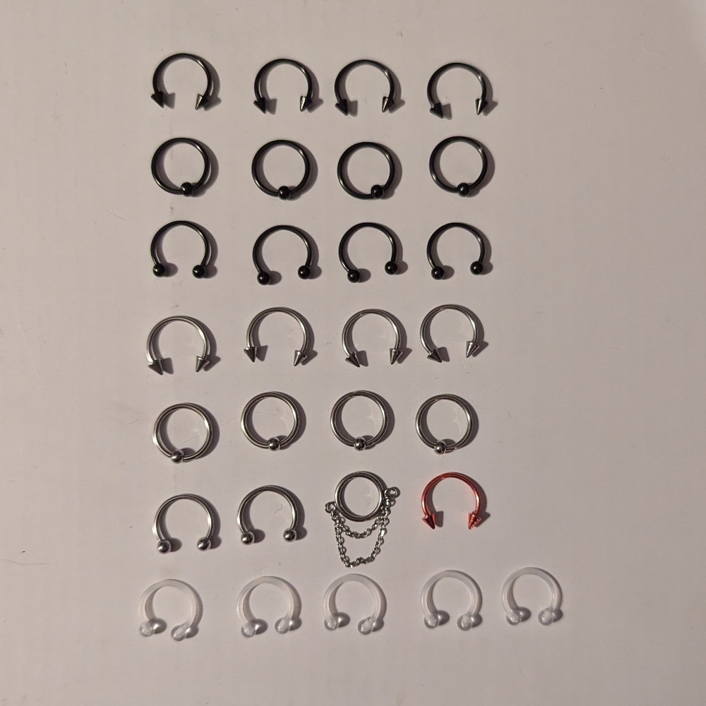 29 UNUSED 16g Septum Rings - 24 Black/Silver/Red Metal & 5 Clear Silicone